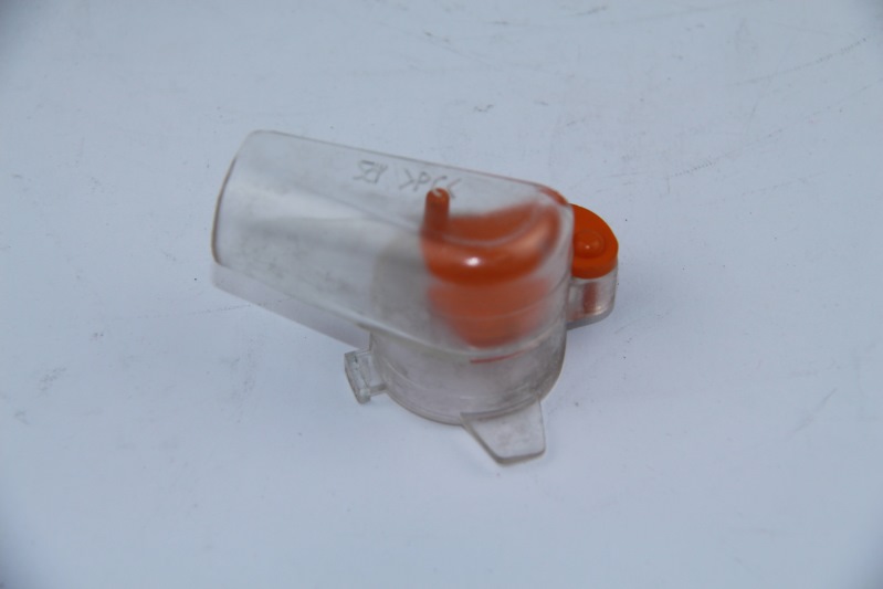 FEED SPOUT INGR. ORANGE WITH LARGE HOLE. LEFT